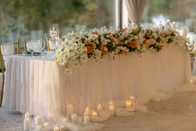 Decorated newlyweds’ table with candles